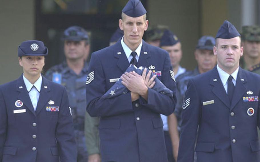 (From left) Staff Sgt. Melanie Parrish, Tech. Sgt. Kenneth Carter and Staff Sgt. Jason Barton, Incirlik Airman Leadership School staff, participate in a joint Turkish and American Sept. 11 ceremony Thursday at Incirlik Air Base, Turkey.