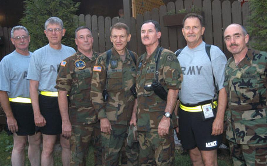 From left: Sgt. Mike Clarkson, a crew attendant, and Chief Warrant Officer 4 Lowell Kennedy, Warrant Officer 4 Bobby Lane, Warrant Officer 4 Roger Riepe, Chief Warrant Officer 5 Craig Roberts, Chief Warrant Officer 4 Duke Russell, and Warrant Officer 4 Steve Sanderson, all pilots, pose for a group photo.