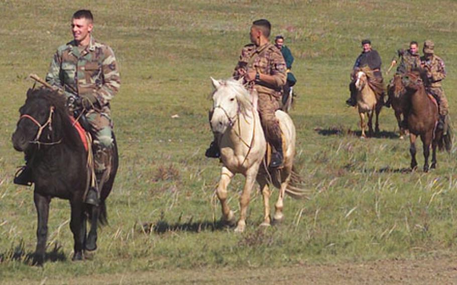 Marines of Co. A, 1/25 return from their first Mongolian horseback patrol during Khaan Quest &#39;03.