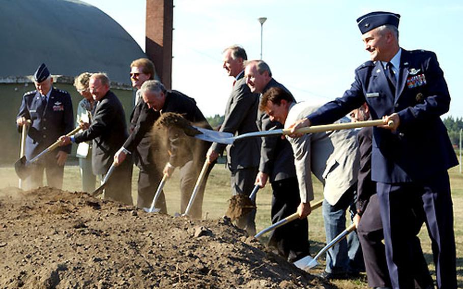 U.S. Air Force Brig. Gen. Erwin F. Lessell III, front, and Lt. Gen. Arthur J. Lichte, back, break ground at the future site of a runway extension at Ramstein Air Base, Germany. The runway project should be complete by the time Ramstein assumes the mission of Rhein-Main Air Base, which is slated to close in 2005.