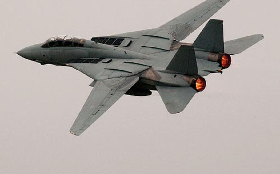 With afterburners lit, an F-14 departs Naval Air Facility Atsugi, Japan.
