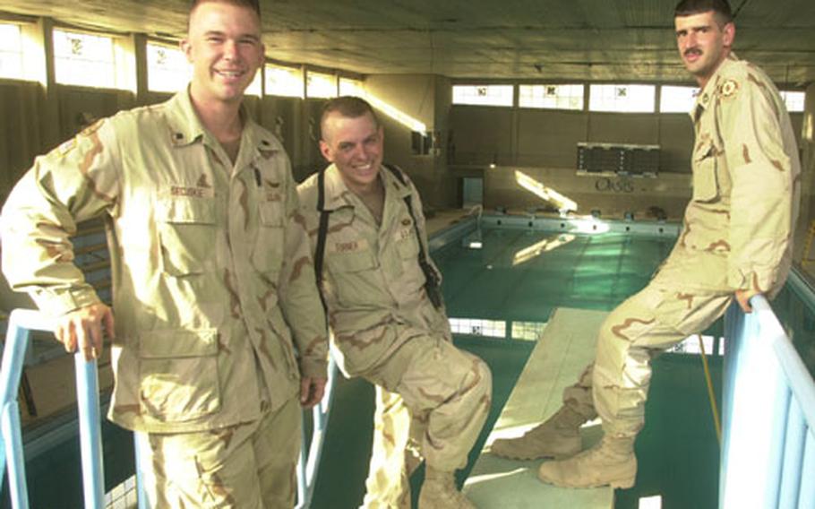 The work took weeks, and the facility is still not 100 percent, but Spc. Bengie Secuskie, left, Chief Warrant Officer 2 Jeff Turner, center, and Sgt. 1st Class Michael P. Riley were part of the group of 4th Squadron, 2nd Armored Cavalry Regiment soldiers who pitched in to clean and repair an Olympic-size indoor pool at Muleskinner Base. The three expect the pool to meet Army regulations by the first of next month. They invite all U.S. soldiers to come use the facility.