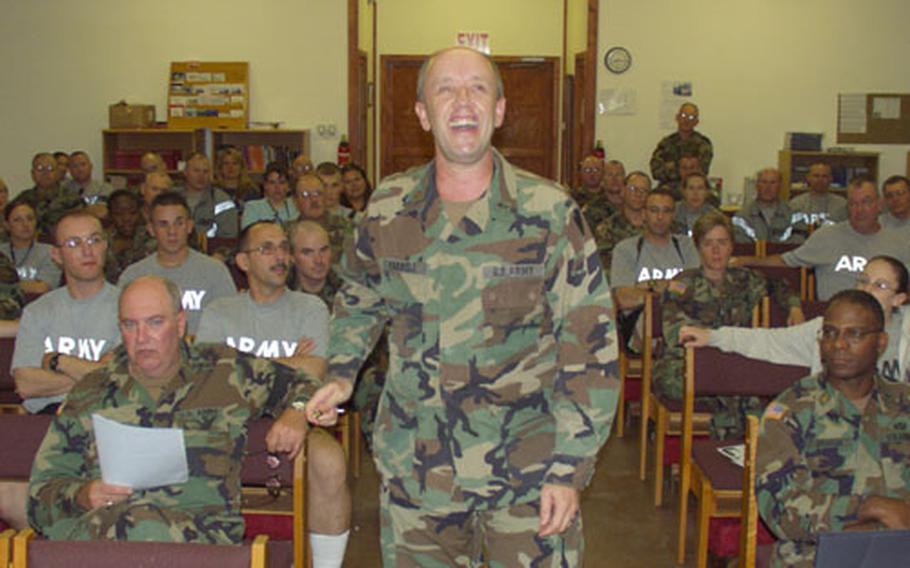 Chaplain (Maj.) Bruce David Farrell, of the 28th Infantry Division, Division Artillery, has some fun with students learning the odyssey of the apostle Paul on Wednesday in a chapel on Camp Bondsteel, Kosovo.