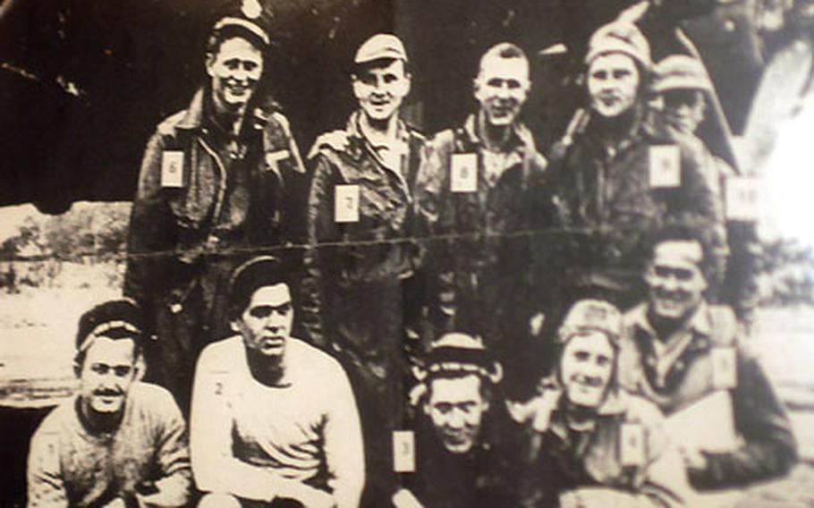 This photo of Capt. Robert W. Cogswell’s crew is displayed in The Globe on the Lake pub in New Alresford, England. Pictured with his crew, Cogswell, second from left in the back row, is credited with saving New Alresford from destruction by guiding his crippled B-17 Flying Fortress away from the town during World War II. Tech. Sgt. Eddie Deerfield, the bomber’s radio operator, is second from left in the front row.