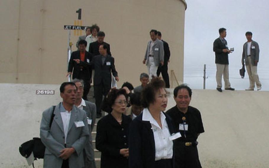 Osan-area community leaders visit an Andersen Air Force Base fuels storage facility.