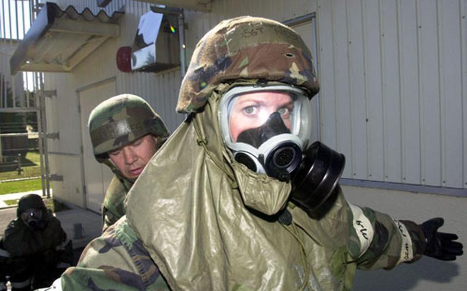 Staff Sgt. Jennifer Nesbit is checked for chemical contaminants.