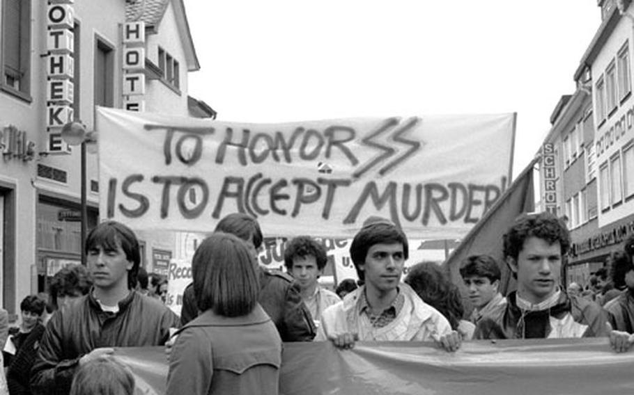 Demonstrators against President Reagan&#39;s visit to a Bitburg cemetery where Waffen SS soldiers were buried participate in a wreath-laying at a Jewish cemetery in Bitburg, Germany, in May, 1985.