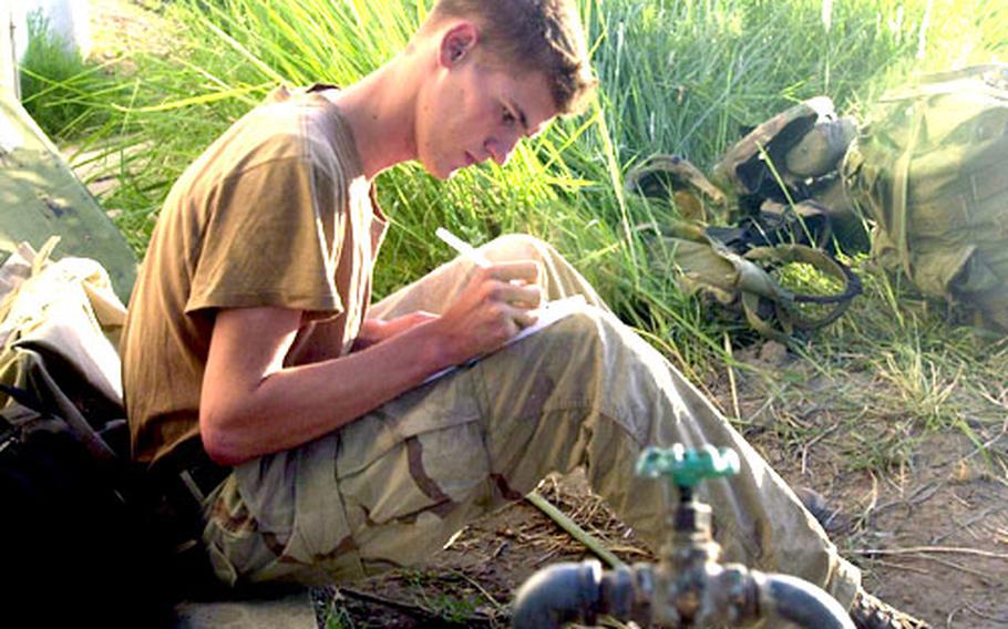 A soldier fills out a Stars and Stripes survey form while stationed in Iraq. Nearly 2,000 troops completed the form.
