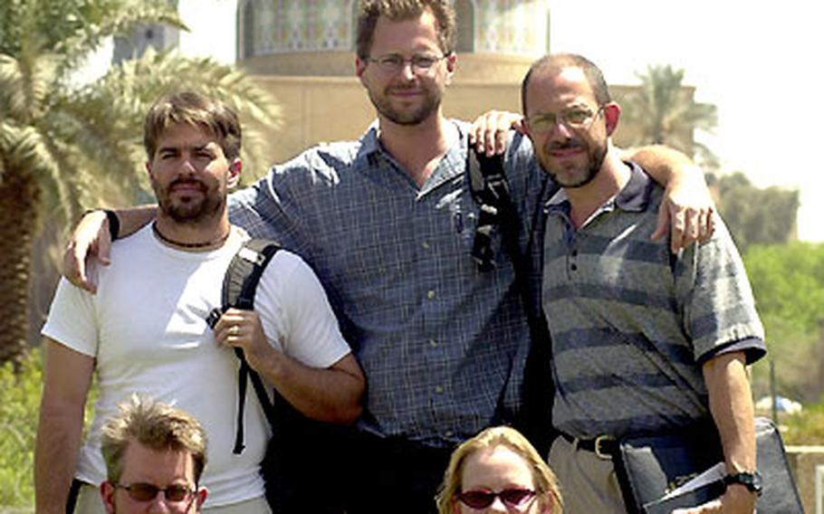 Stars and Stripes reporters fanned out across Iraq to talk to troops about the conditions and their morale in Iraq. Pictured in front are reporters David Josar and Marni McEntee. In the back, from left, are Scott Schonauer, Jon Anderson and Steve Liewer. Not pictured: Terry Boyd, Lisa Burgess, Sandra Jontz and Ward Sanderson.