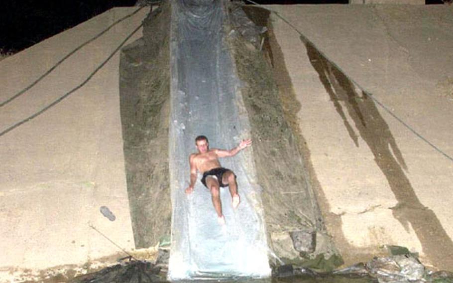 Some troops take rest and relaxation into their own hands. An artillery battery at Kirkuk Air Base in Iraq built this water slide along the side of an old Iraq bunker.
