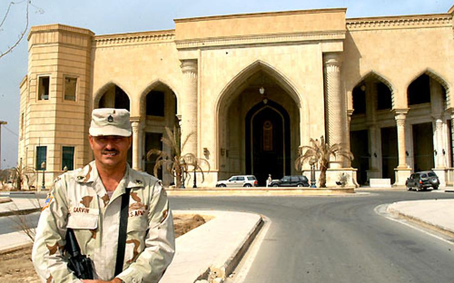 Staff Sgt. Russell Garvin stands in front of the Al Faw palace.