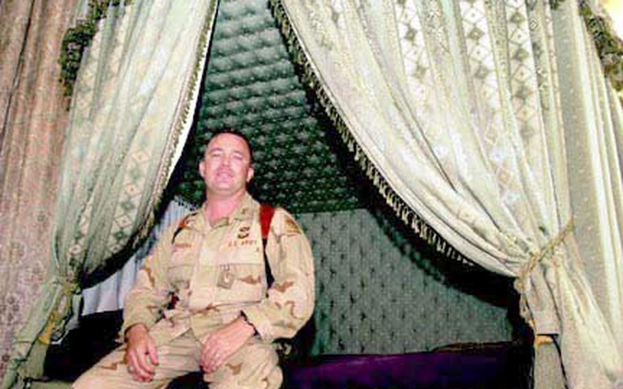 Lt. Col. William Rabena, 2nd Battalion, 3rd Field Artillery Regiment of the 1st Armored Division, is the officer who sleeps in what was once Odai Hussein’s bed.