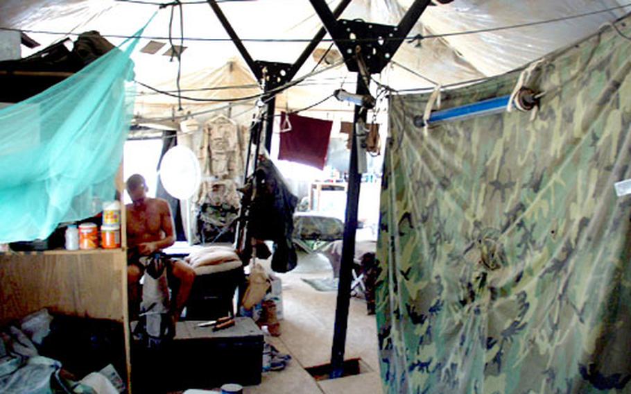 Reserve soldiers assigned to Camp Bucca, an enemy prisoner-of-war camp in southern Iraq, live in tents like these. They did not have air conditioning.
