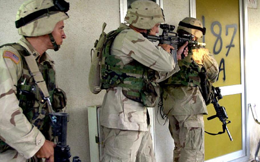 Soldiers with the 82nd Airborne Division raid a home near Baghdad International Airport in August. The soldiers acted on a tip that the owner was hiding or had information about surface-to-air missiles.