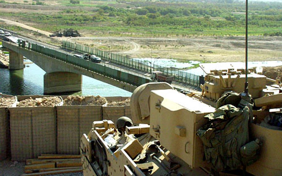 A Bradley Fighting Vehicle at a position overlooking a bridge outside of Tikrit, Iraq. Some units are reporting supply and equipment shortages; officers say such shortages are not as pervasive as they appear.