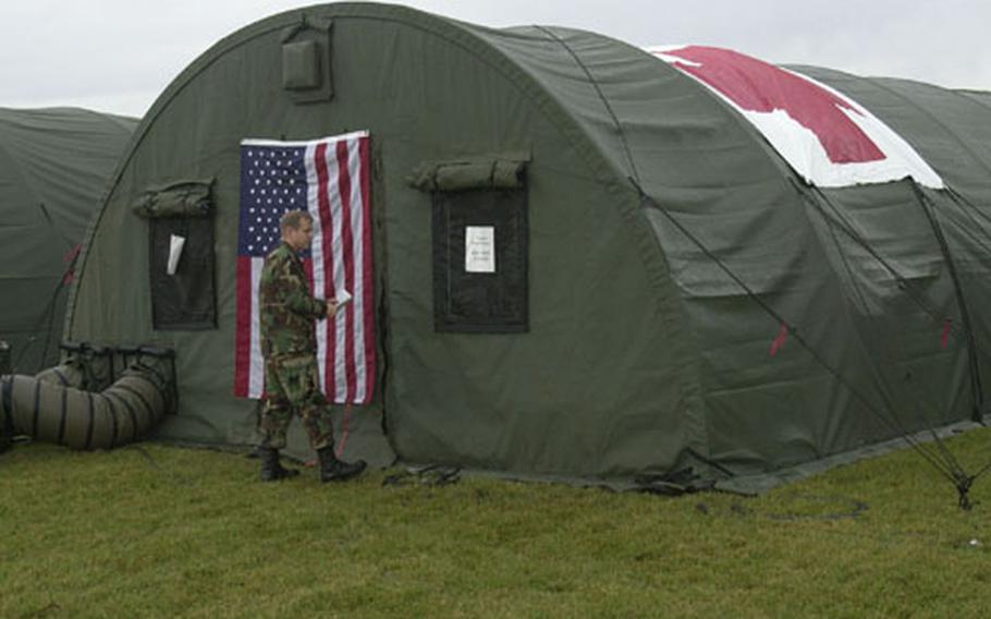 Yokota Air Base&#39;s Expeditionary Medical Support team operates in a field hospital consisting of self-sufficient and contained Alaskan huts or tents.
