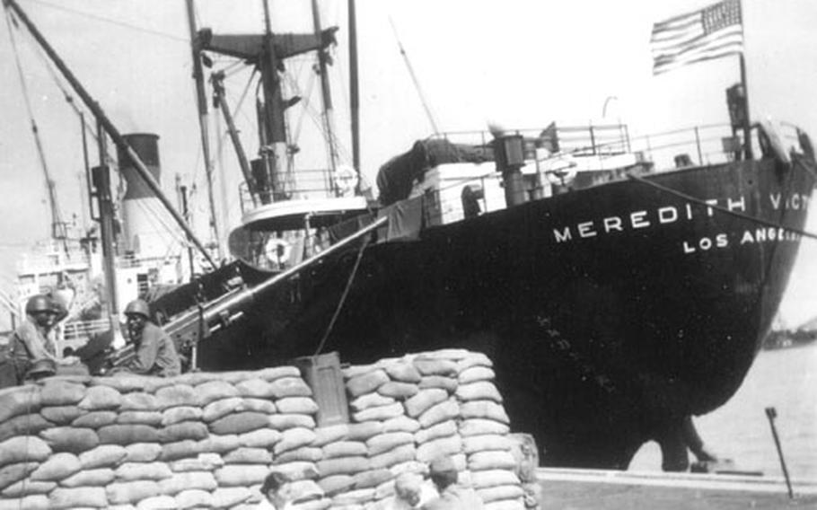 The SS Meredith Victory sits alongside the dock in Pusan.
