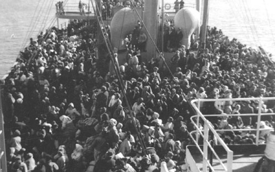 The aft deck of the SS Meredith Victory was packed with refugees when it left Hungnam, North Korea, in December 1950 for South Korea to escape encroaching Chinese and North Korean troops.