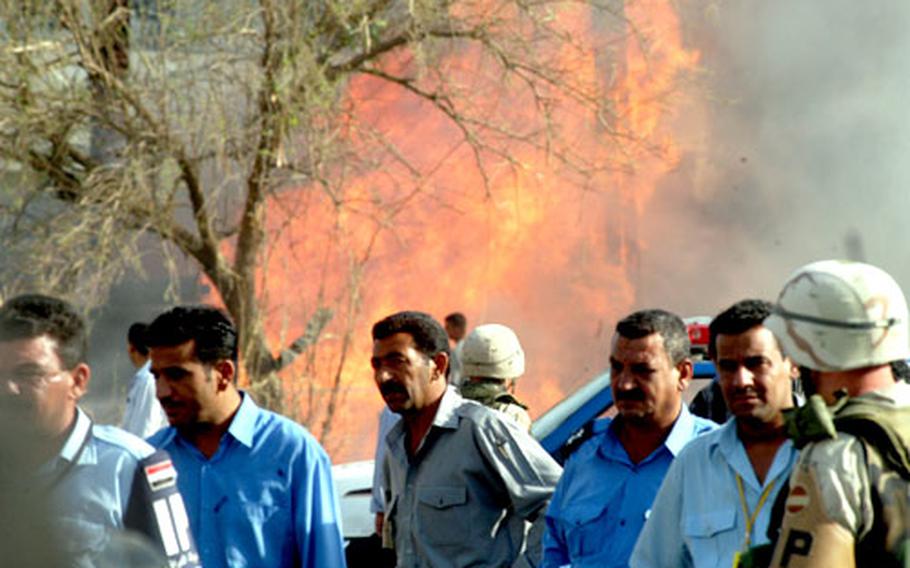 Flames rise from the scene of an explosion Monday morning at the International Committee of the Red Cross in Baghdad.
