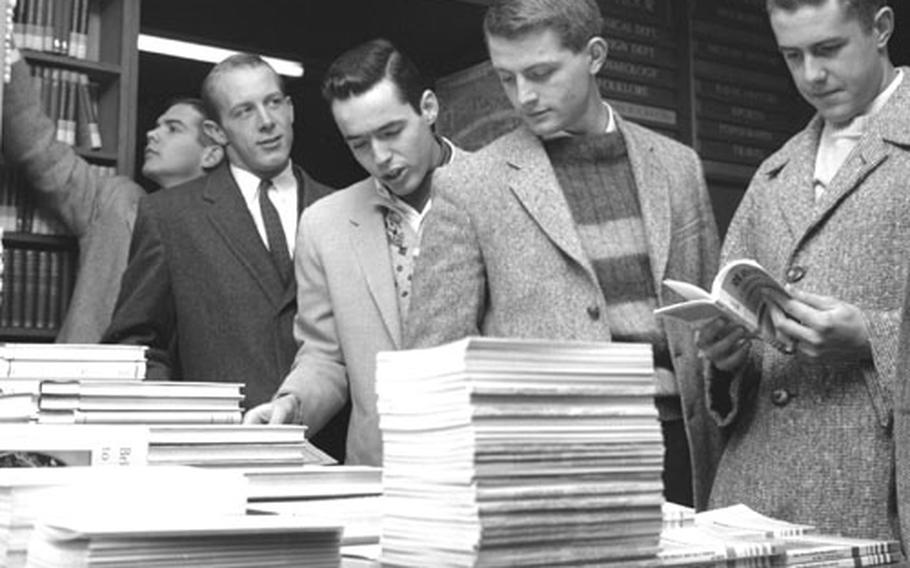 The Rhodes scholars gather material at an Oxford bookstore.