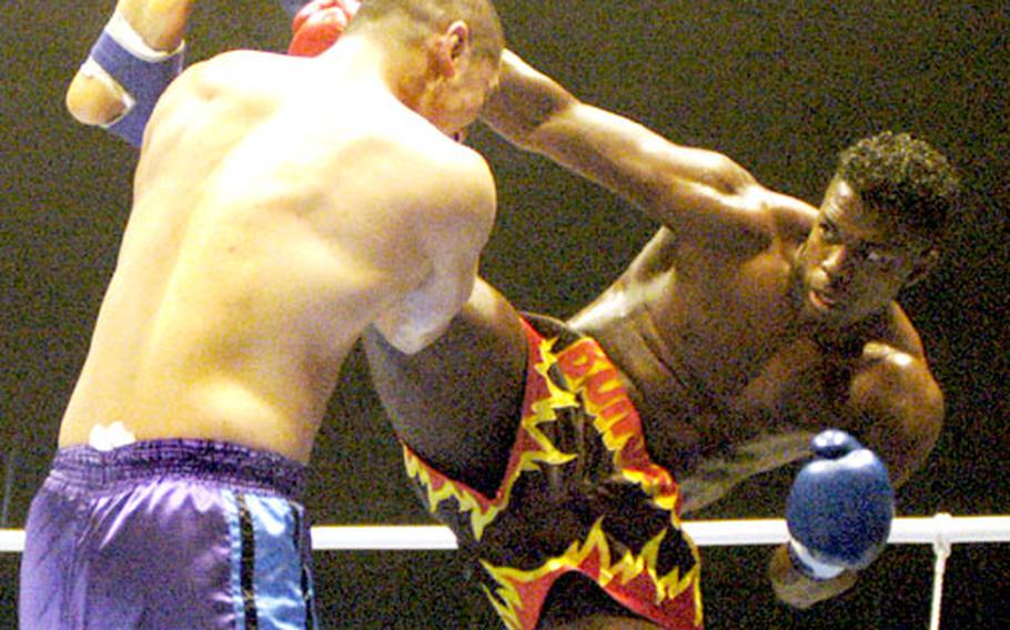 K-1 world GP 2003 champion Remy Bonjaskky from Holland delivers a knockout kick to the head on Tsuyoshi Nakasako.