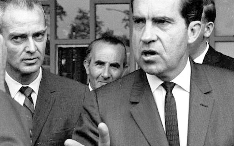 Richard Nixon stops for a conversation on his way through the Frankfurt airport.