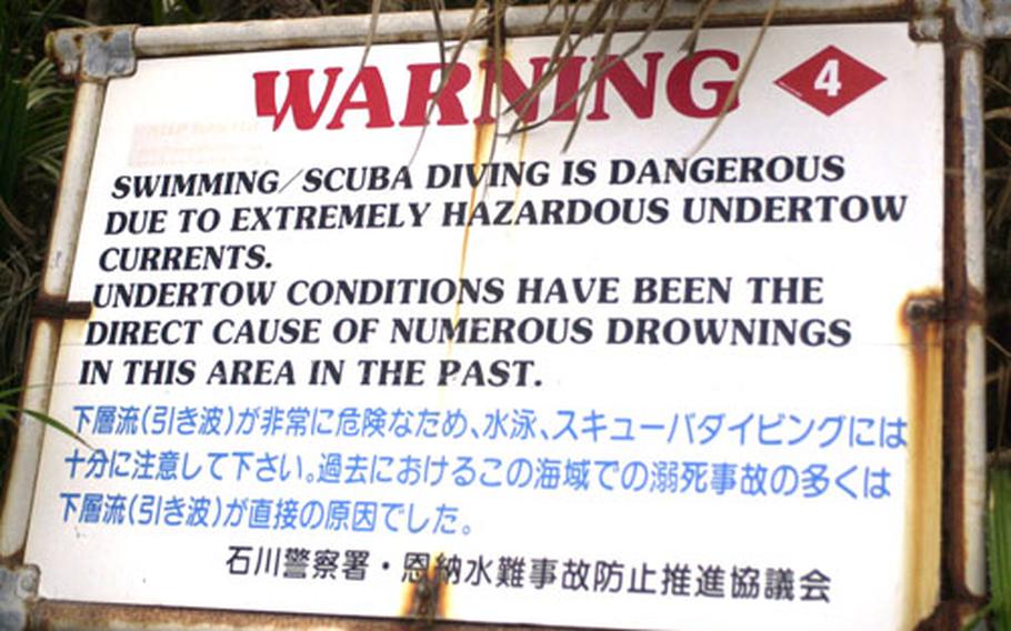 A sign at Maeda Point warns divers and swimmers of the dangerous undertow in the area. Marine Lance Cpl. John W. Jeffries II drowned March 6 while snorkeling in the area during rough sea conditions.