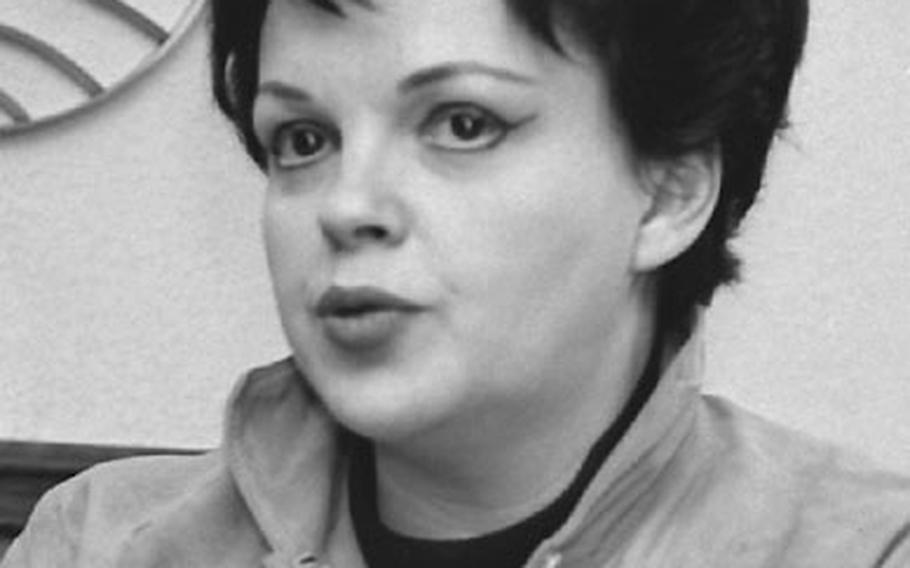 Singer and actress Judy Garland arrives at Frankfurt, then meets the press, on her way to a Kennedy-for-President rally just before the 1960 election.