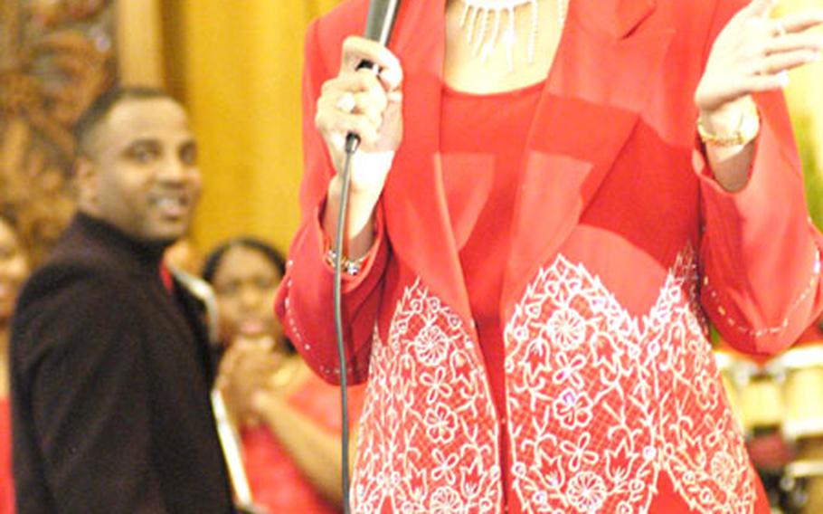 Gospel singer Dorinda Clark-Cole belts out songs Saturday night during a free concert at the Camp Foster Chapel.