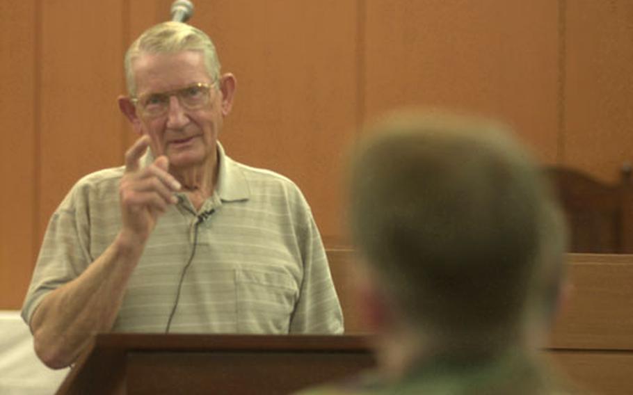 Retired Lt. Col. Ben Purcell speaks to about two dozen soldiers from the 1st Signal Brigade Monday at Memorial Chapel. Purcell spent 62 months in captivity in Viet Cong prison camps from 1968 to 1972.