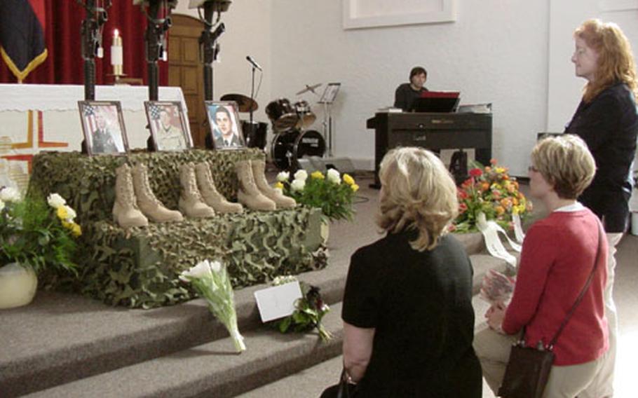 Members of the Schweinfurt, Germany, community pay tribute to three 1st Infantry Division soldiers killed in Iraq during a service in the community chapel oon Thursday. The soldiers were Sgt. Brian M. Wood of Company A, 9th Engineer Battalion; Spc. Richard K. Trevithick of Company C, 9th Engineer Battalion; and Spc. Marvin K. Campo-Siles of the Headquarters and Headquarters Company, 1st Battalion, 26th Infantry Regiment.