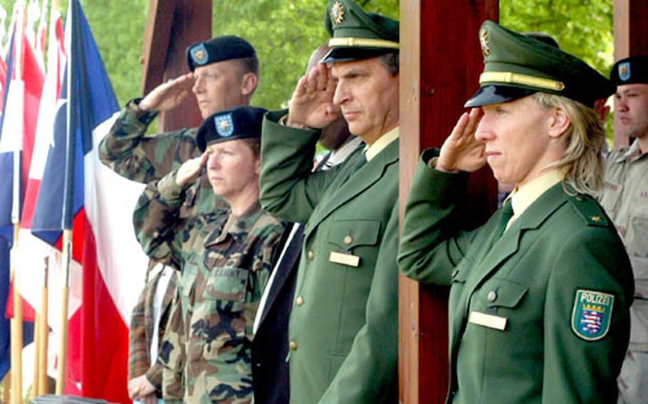 Catrin Rahn and Helmut Biegi of the Damstadt Police station joined Darmstadt leadership in welcoming home the 22nd Signal Brigade.