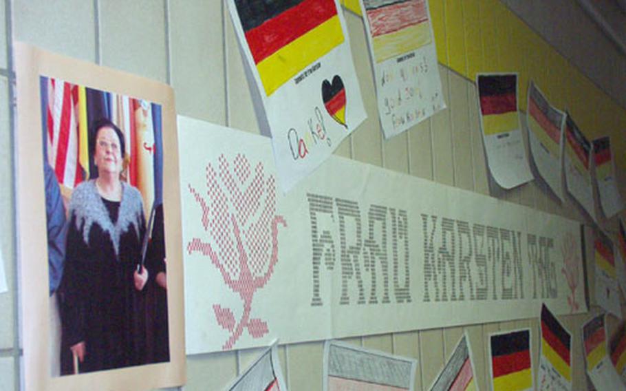 Posters and tributes plaster the walls Friday at Würzburg Middle School, Germany, for "Frau Karsten Tag." The school had prepared a surprise daylong tribute to Ursula Karsten, the school&#39;s German culture and language teacher, in honor of her 40 years of teaching for Department of Defense Dependents Schools.