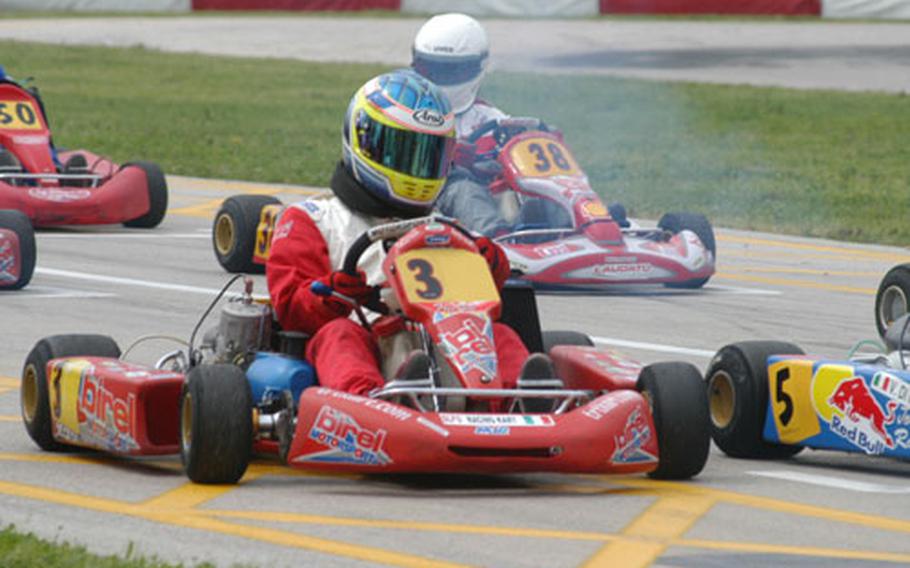 Paul Kloepping (No. 3) waits for his race to begin at a Go Kart track in Casaluce, near Naples, Italy. Kloepping regularly is the only American racer at tracks around Italy when the professionals race.
