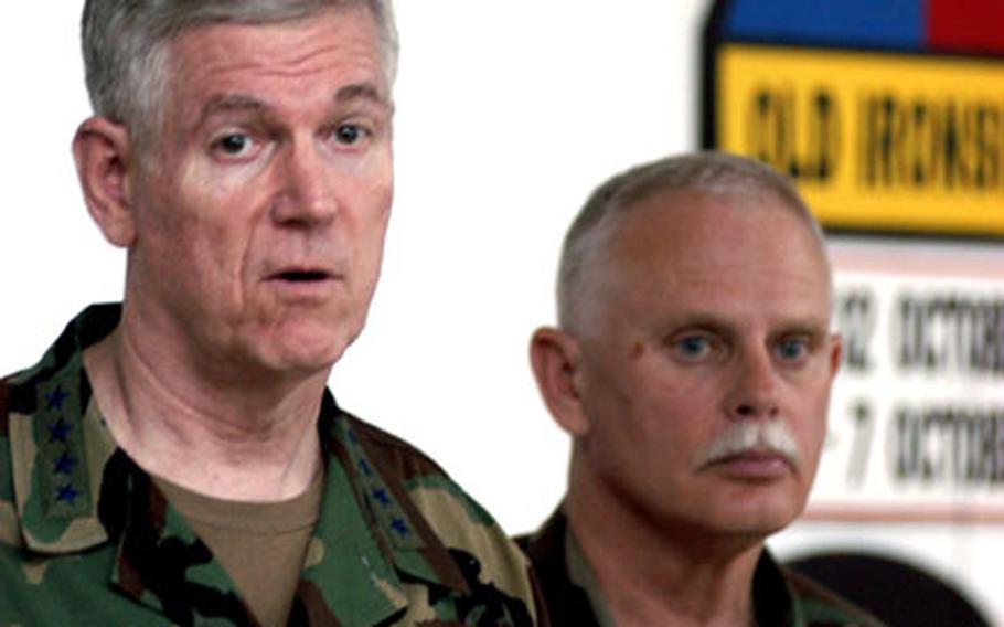Gen. Richard Myers answers questions during a brief meeting with the press at Eagle Base. At right is Brig. Gen. Timothy Wright, commander of Multinational Brigade North and commander of the Indiana National Guard&#39;s 38th Infantry Division in Bosnia.