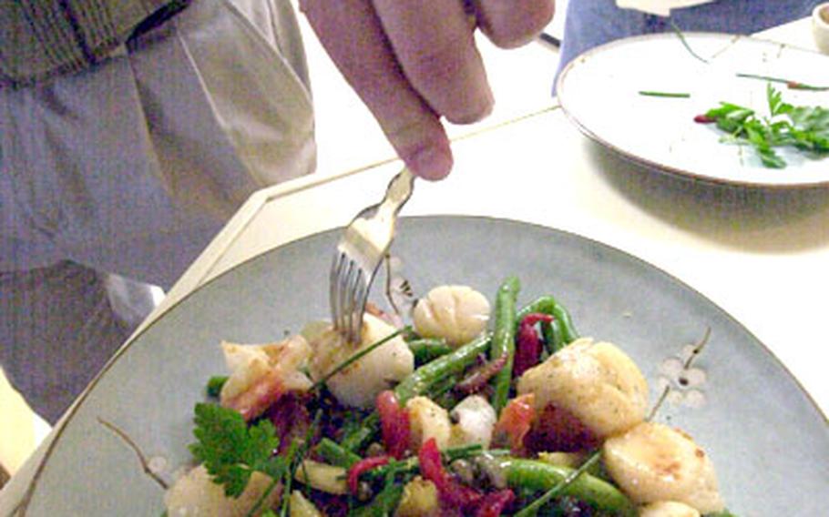 One of Pat McAndrew&#39;s creations, shrimp and scallops with green beans and chili sauce.