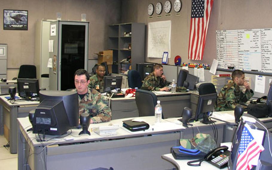 Airmen staff the computer help desk inside the network control center at Osan Air Base, South Korea.