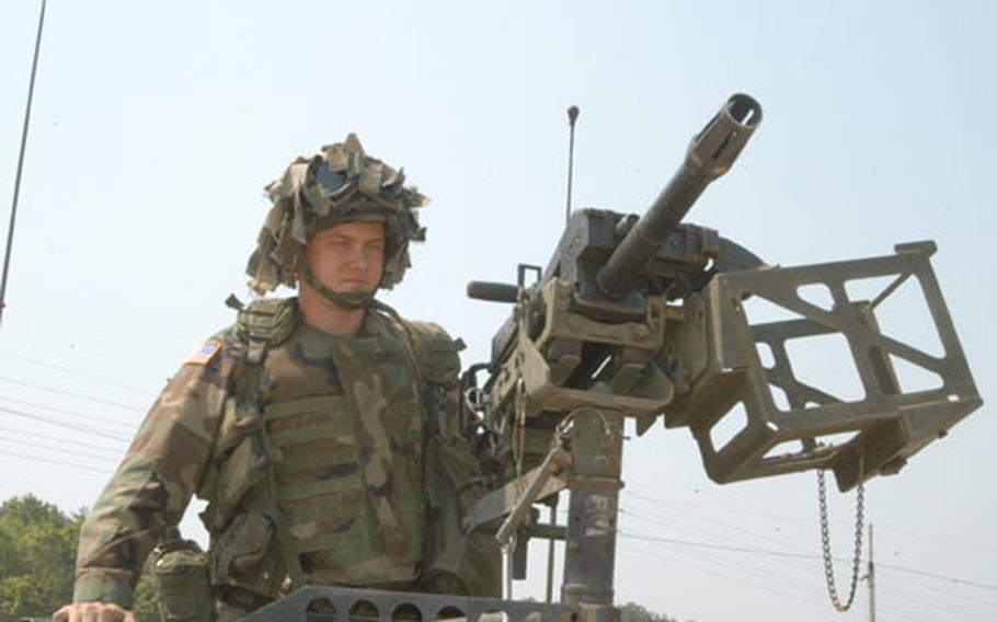 Spc. Jeremy Lentz preparing to shoot the Mark 19 grenade launcher in Warrior Valley on Thursday.