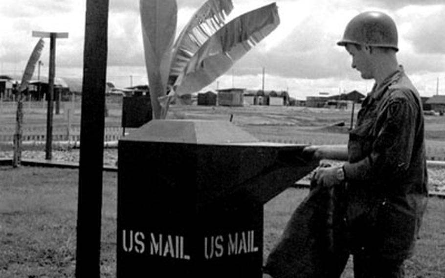 A soldier mails a letter at the corner of Stateside and Stateside at Tay Ninh in October, 1968.