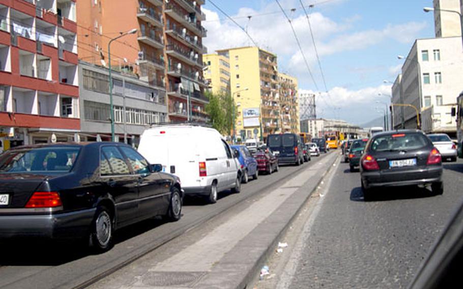 Traffic in Naples can never be called orderly, as seen here by the cars packing the off-limits transit-only lane. Add cobblestone streets, windshield washers, tissue paper salesmen and the occasional thief or carjacker, and Naples becomes a challenge for drivers.