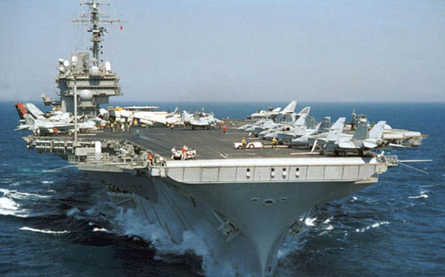 Navy officials announced that the USS Kitty Hawk, a 45-year-old aircraft carrier powered by steam turbine engines, is scheduled to remain in Japan through 2008.