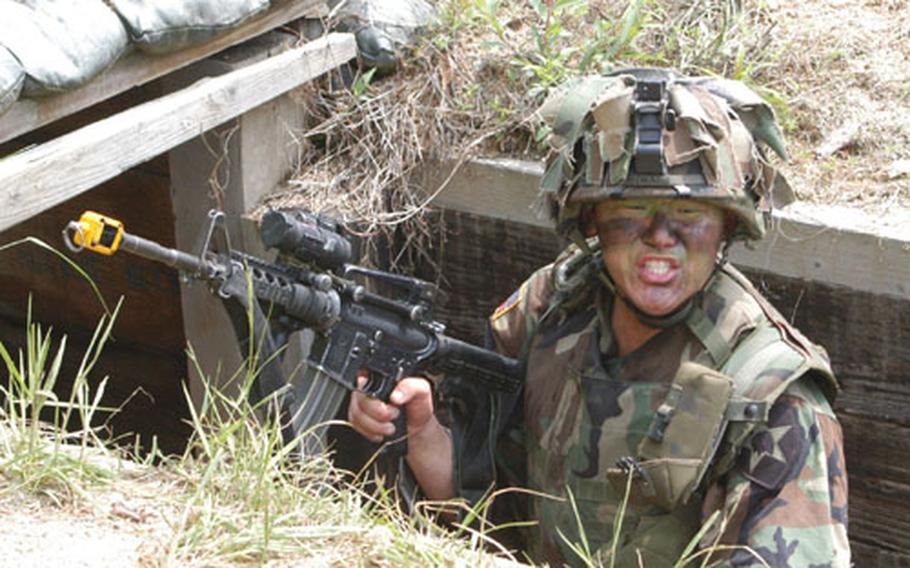 The leader of 1st Platoon, B Company, 2-9 Infantry Regiment 2nd Lt. Rank Hwang reacts to a surprise attack at Mohawk Range.