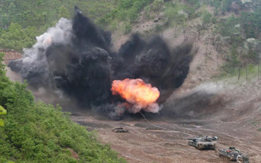Engineers detonate a mine clearing line charge (MICLIC) in Warrior Valley.