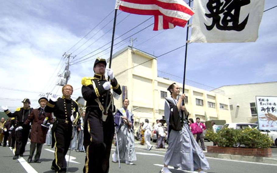 Men dressed up as Commodore Matthew Perry and Japanese lords reminiscent of 1854 signing of the U.S.-Japan Trade and Amity Treaty paraded through Shimoda City during the 65th Annual Black Ship Festival.