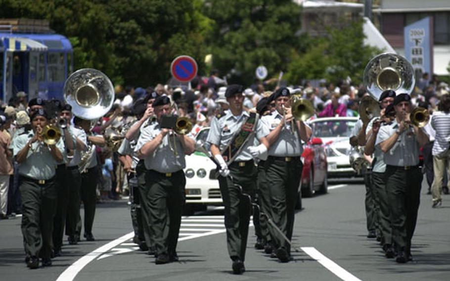 The U.S. Army Japan Band parades to a full crowd through the streets of Shimoda City on Saturday.