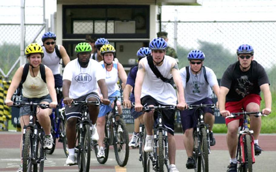 The Atsugi Naval Air Facility Security Bicycle Patrol rides out of Naval Support Facility Kamiseya as part of the two-day training program.