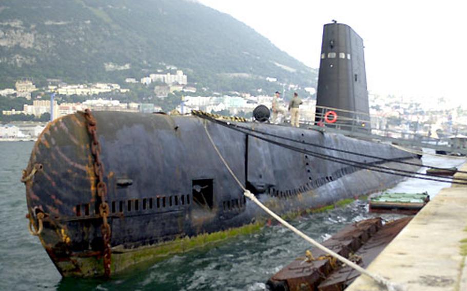 The World War II-era submarine USS Razorback moored Tuesday in Gibraltar. Navy veterans are bringing the submarine from Turkey to an Arkansas riverfront museum.