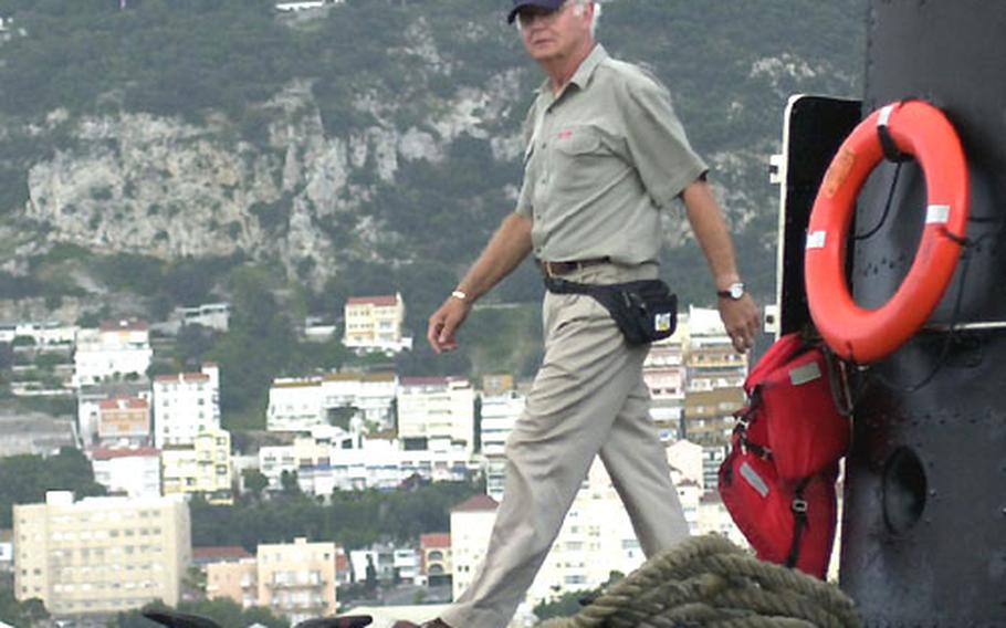 Navy veteran Bob Opple walks on the USS Razorback on Tuesday in Gibraltar.