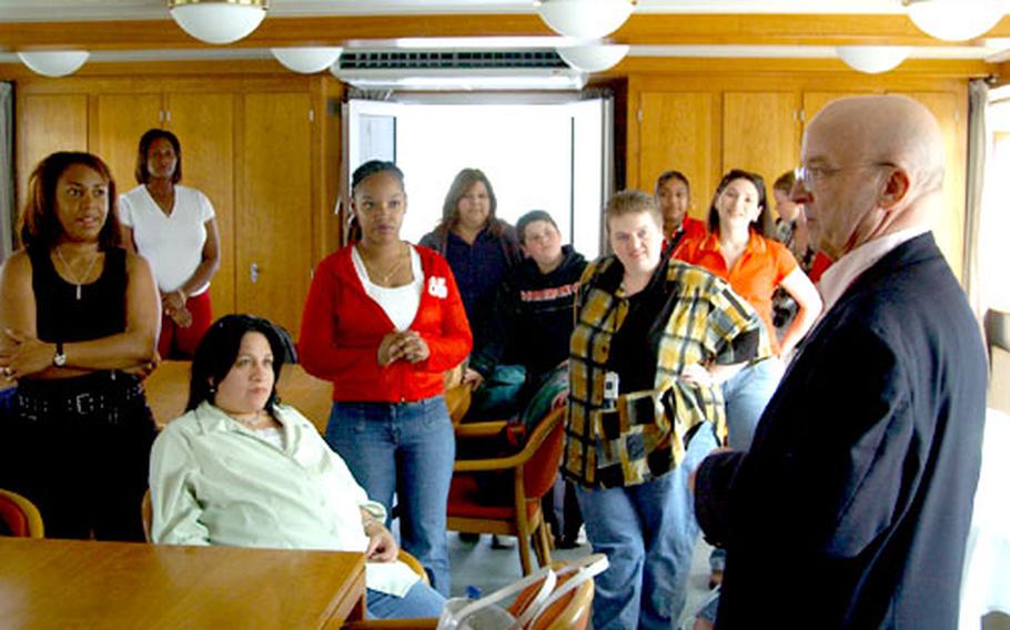 Paul Prengel talks to Baumholder military spouses and family members during the Rhine River cruise.