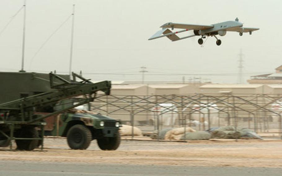 The 1st Infantry Division’s Tactical Unmanned Aerial Vehicle takes flight during a test run at Forward Operating Base Remagen, Iraq, on May 10. The vehicle is launched from a hydraulic rail launcher.